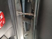 Front door check strap stopper