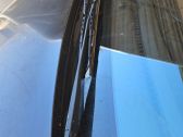 Front wiper blade arm