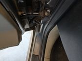 Front door check strap stopper