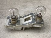 Tail light bulb cover holder