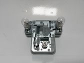 Tail light bulb cover holder