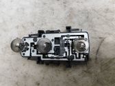 Tail light bulb cover holder