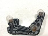 Tail light bulb cover holder