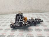 Tail light bulb cover holder