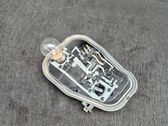 Tail light bulb cover holder