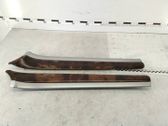 Front door trim bar