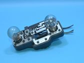 Tail light bulb cover holder