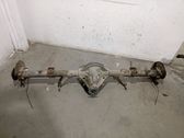 Rear axle beam with reductor