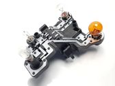 Tail light bulb cover holder