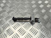 Front door check strap stopper