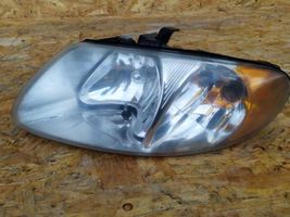 Dodge Caravan Lampa przednia 04857701ab