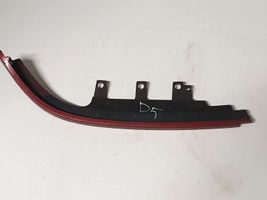 Mazda 323 F Rivestimento sotto il faro/fanale K2443