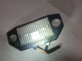 Ford Mondeo Mk III Lampa oświetlenia tylnej tablicy rejestracyjnej 1S7113550AC