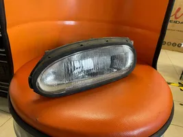 Nissan NX 100 Lampa przednia E13020289
