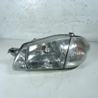 Mazda 323 Lampa przednia 1305235392