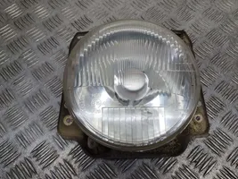 Volkswagen Golf II Lampa przednia 87044302