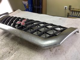 Mitsubishi Pajero Sport I Grille calandre supérieure de pare-chocs avant Mr478595