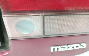 Mazda 626 Copertura striscia fanale posteriore/targa 0431394