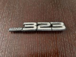 Mazda 323 Logo, emblème de fabricant 