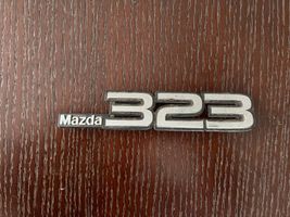 Mazda 323 Logo, emblème de fabricant 