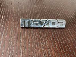 Mazda 323 Valmistajan merkki/logo/tunnus 