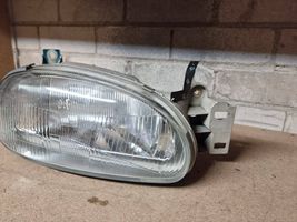 Mazda 121 Lampa przednia 0014095