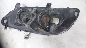 Opel Zafira A Lampa przednia 89100055