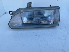 Toyota Corolla E90 Lampa przednia 082121140