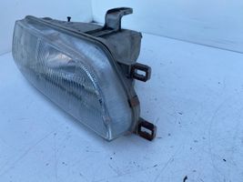 Toyota Corolla E90 Lampa przednia 12307