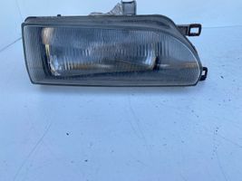 Toyota Corolla E90 Lampa przednia 12307