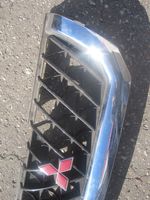 Mitsubishi Pajero Sport I Grille calandre supérieure de pare-chocs avant MR478595