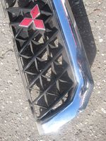 Mitsubishi Pajero Sport I Grille calandre supérieure de pare-chocs avant MR478595