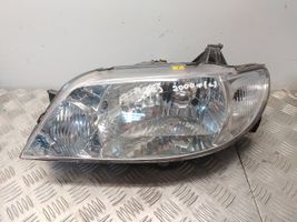 Mazda 323 F Lampa przednia 1157NA