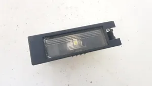 Opel Tigra B Lampa oświetlenia tylnej tablicy rejestracyjnej 09164143