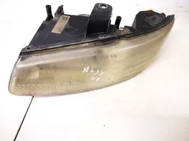 Chrysler Voyager Lampa przednia 04576313ad