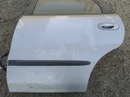 Nissan Almera Tino Portiera posteriore pilkos