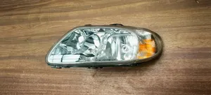 Chrysler Voyager Lampa przednia 04857703AB