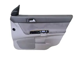 Volvo V50 Garniture de panneau carte de porte avant 39879455