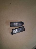 Volkswagen Golf VI Lampa oświetlenia tylnej tablicy rejestracyjnej 1K8943021