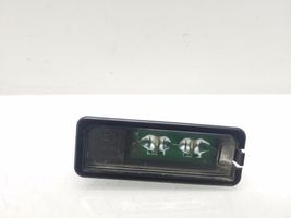 Volkswagen PASSAT B7 Lampa oświetlenia tylnej tablicy rejestracyjnej 1K8943021C