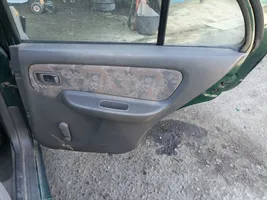 Nissan Almera Apmušimas galinių durų (obšifke) 