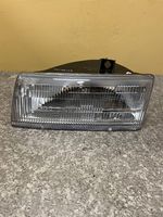 Dodge Caravan Lampa przednia 033331103