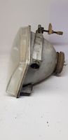 Ford Escort Lampa przednia 002124099