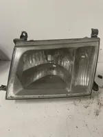 Toyota Land Cruiser (J100) Lampa przednia UPM600F20