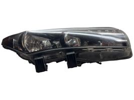 Toyota Corolla E160 E170 Lampa przednia 8111002E71