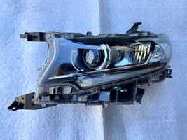 Toyota Land Cruiser (J150) Lampa przednia 8118560N20