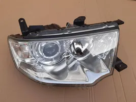 Mitsubishi Pajero Uchwyt / Mocowanie lampy przedniej 8301A878