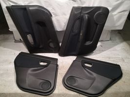 Subaru Impreza II Set di rivestimento del pannello della portiera 94235FE020