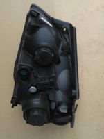 KIA Carens II Lampa przednia 