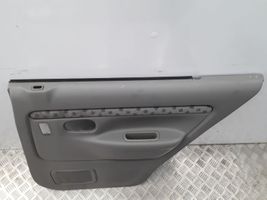 Mazda Demio Garniture panneau de porte arrière D28068520